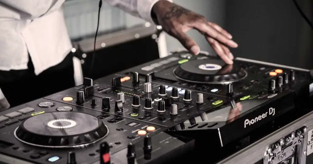DJ controllers are used to control DJ software on your laptop, however there are also a few fully-standalone DJ controllers in the market such as the XDJ-RX visible on the photo. 